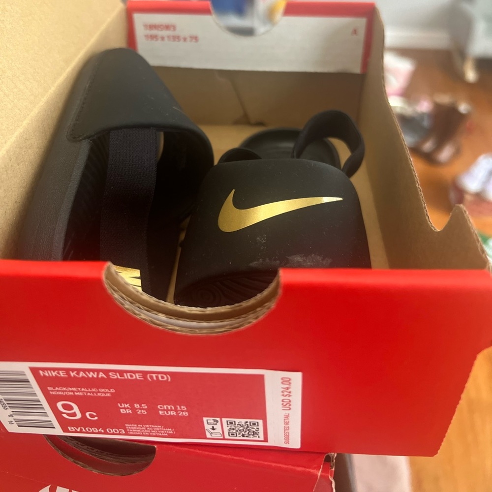 Size 9 Nike sandals black and gold